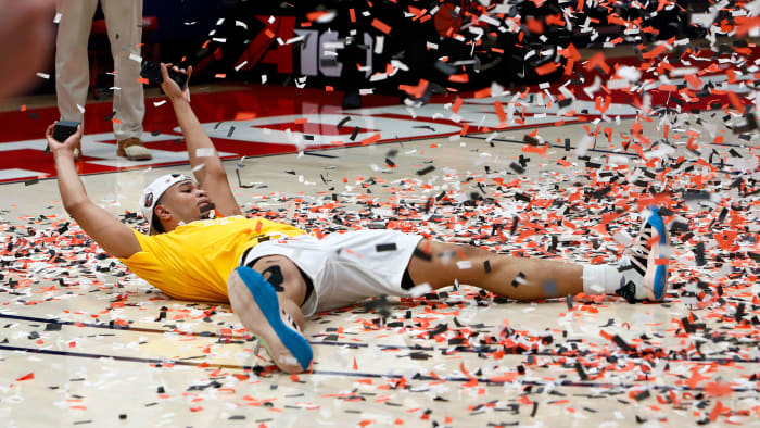 St. Bonaventure's Jaren Holmes soaks in the confetti after an A-10 championship win